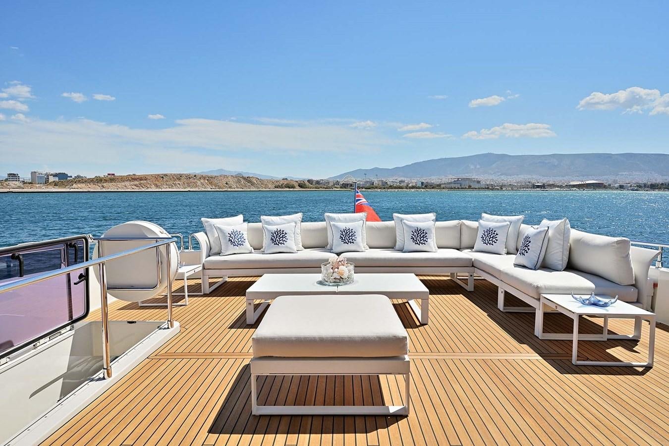 a deck with a table and chairs on it aboard HULL 21 Yacht for Sale