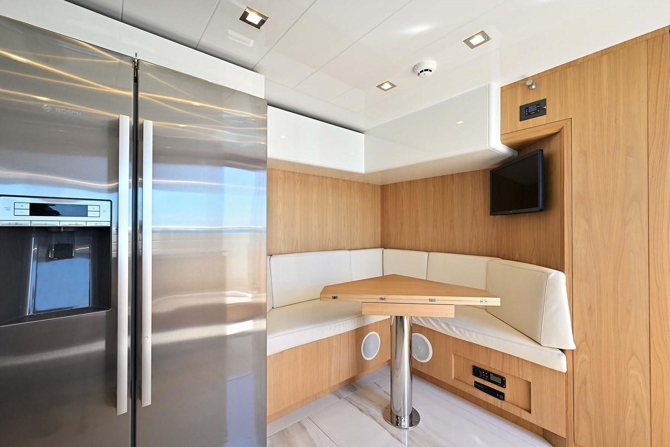 a room with a bed and a table aboard HULL 21 Yacht for Sale