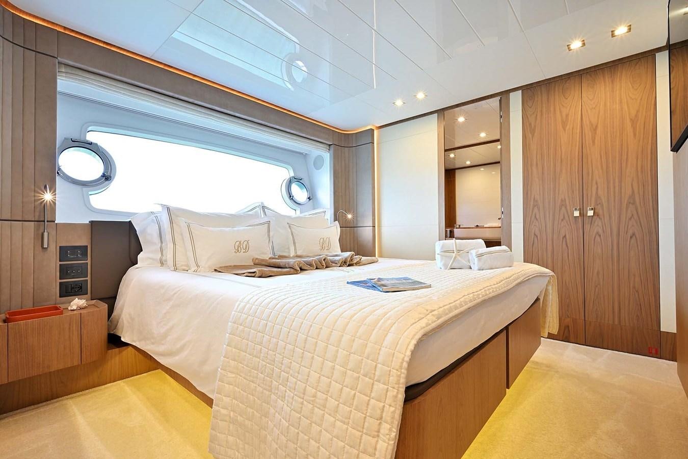 a room with a bed and a window aboard HULL 21 Yacht for Sale