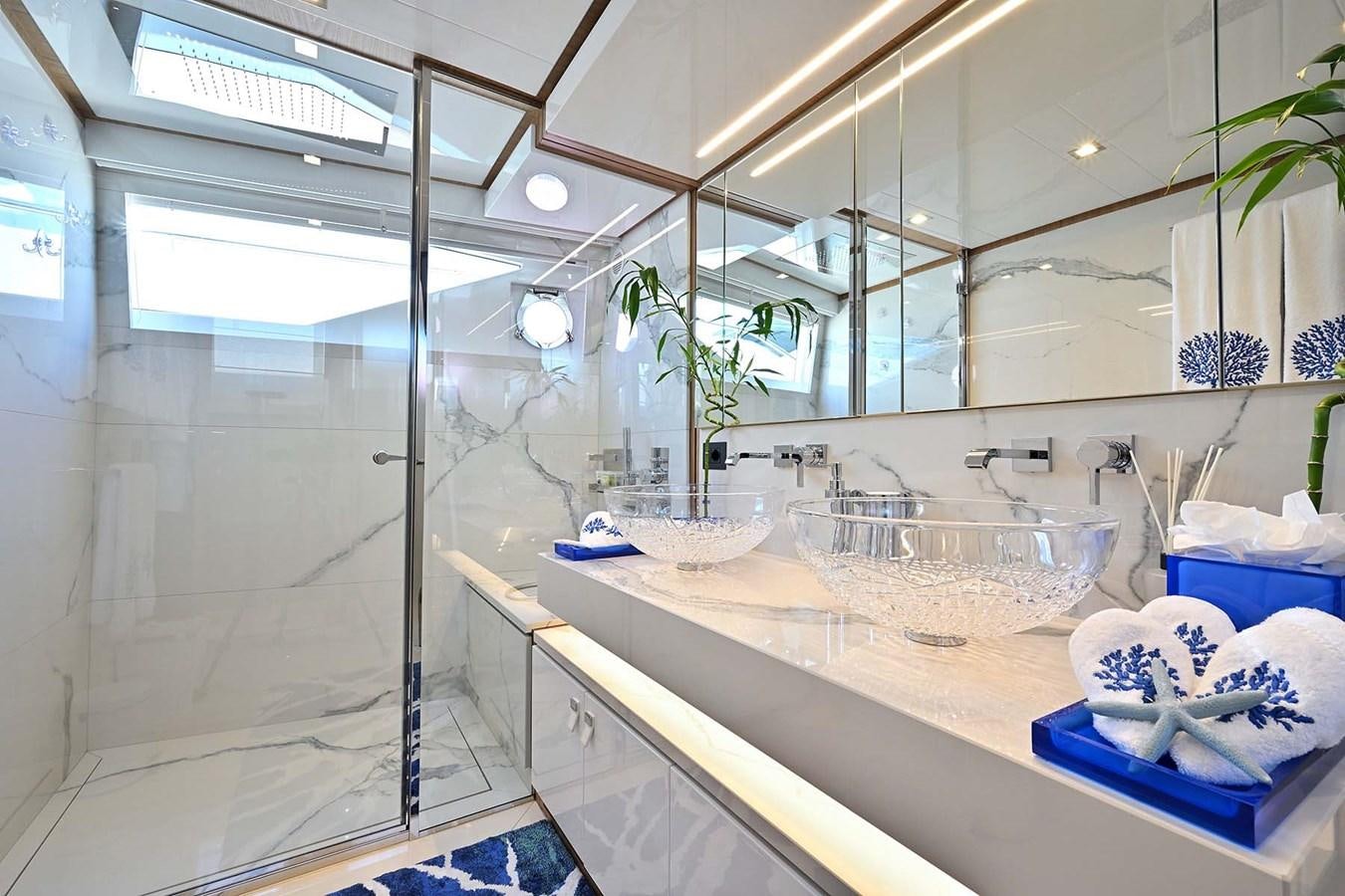 a bathroom with a glass shower aboard HULL 21 Yacht for Sale
