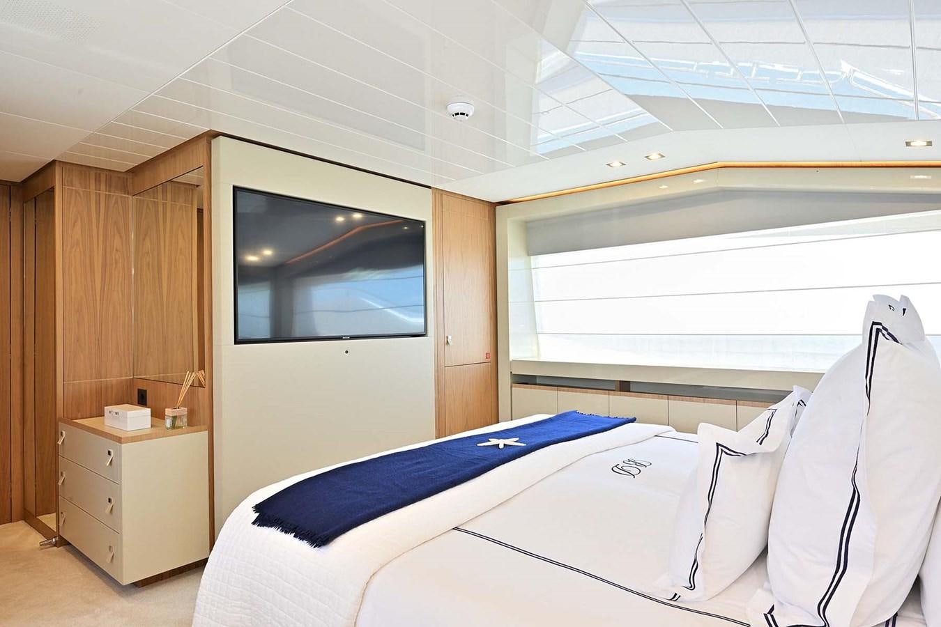a room with a bed and a television aboard HULL 21 Yacht for Sale