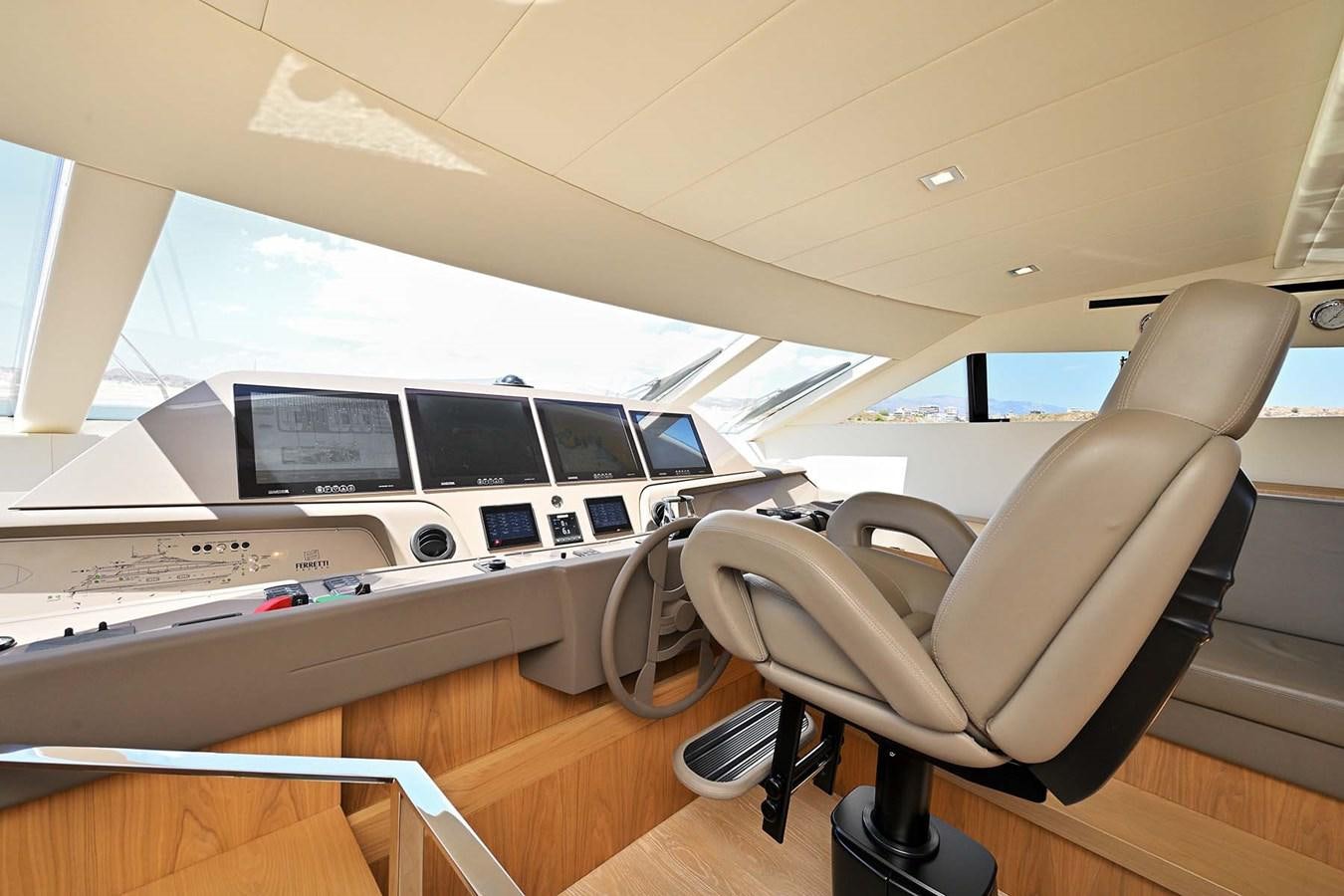 a chair next to a computer aboard HULL 21 Yacht for Sale