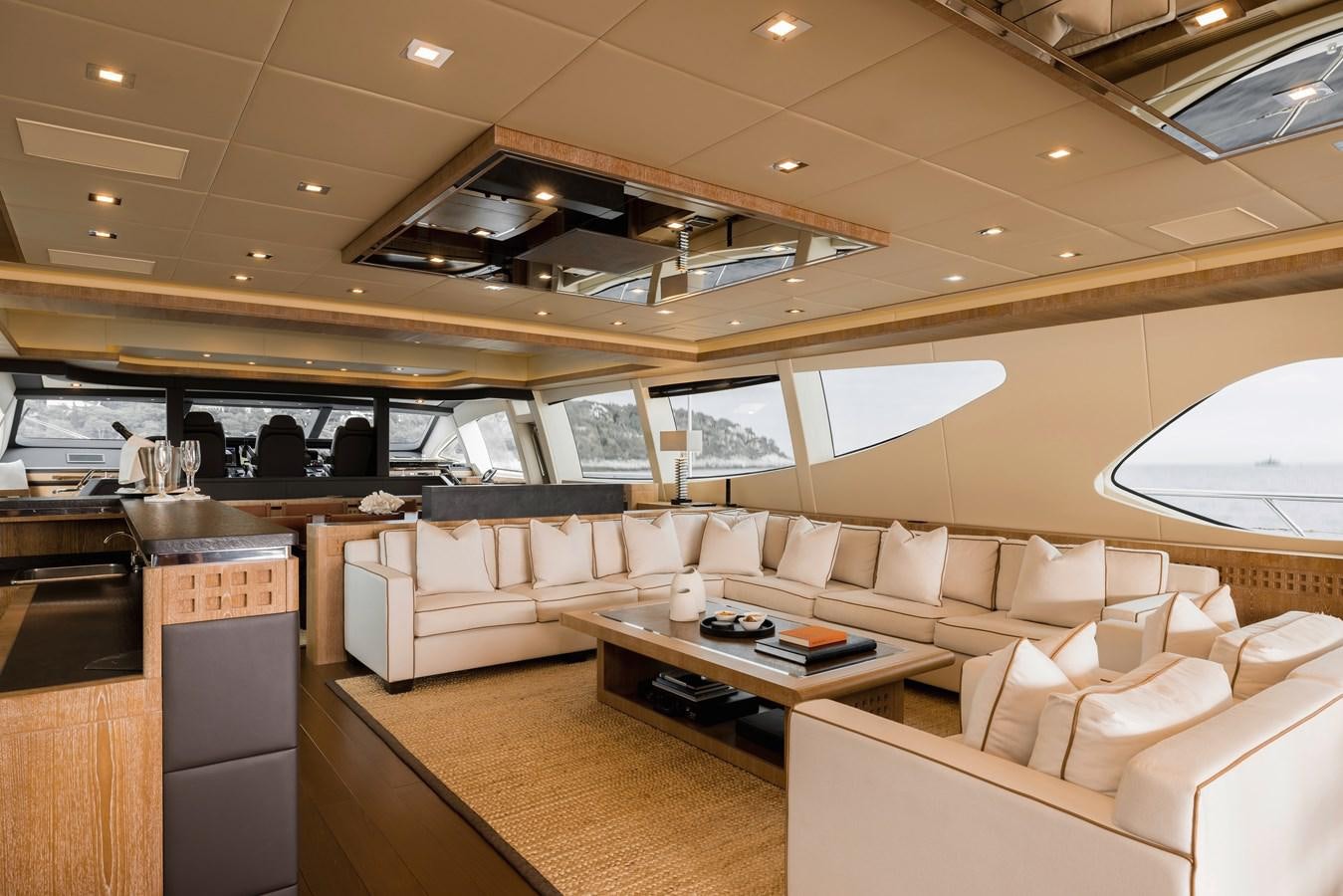 a room with couches and a table aboard ROYALE X Yacht for Sale