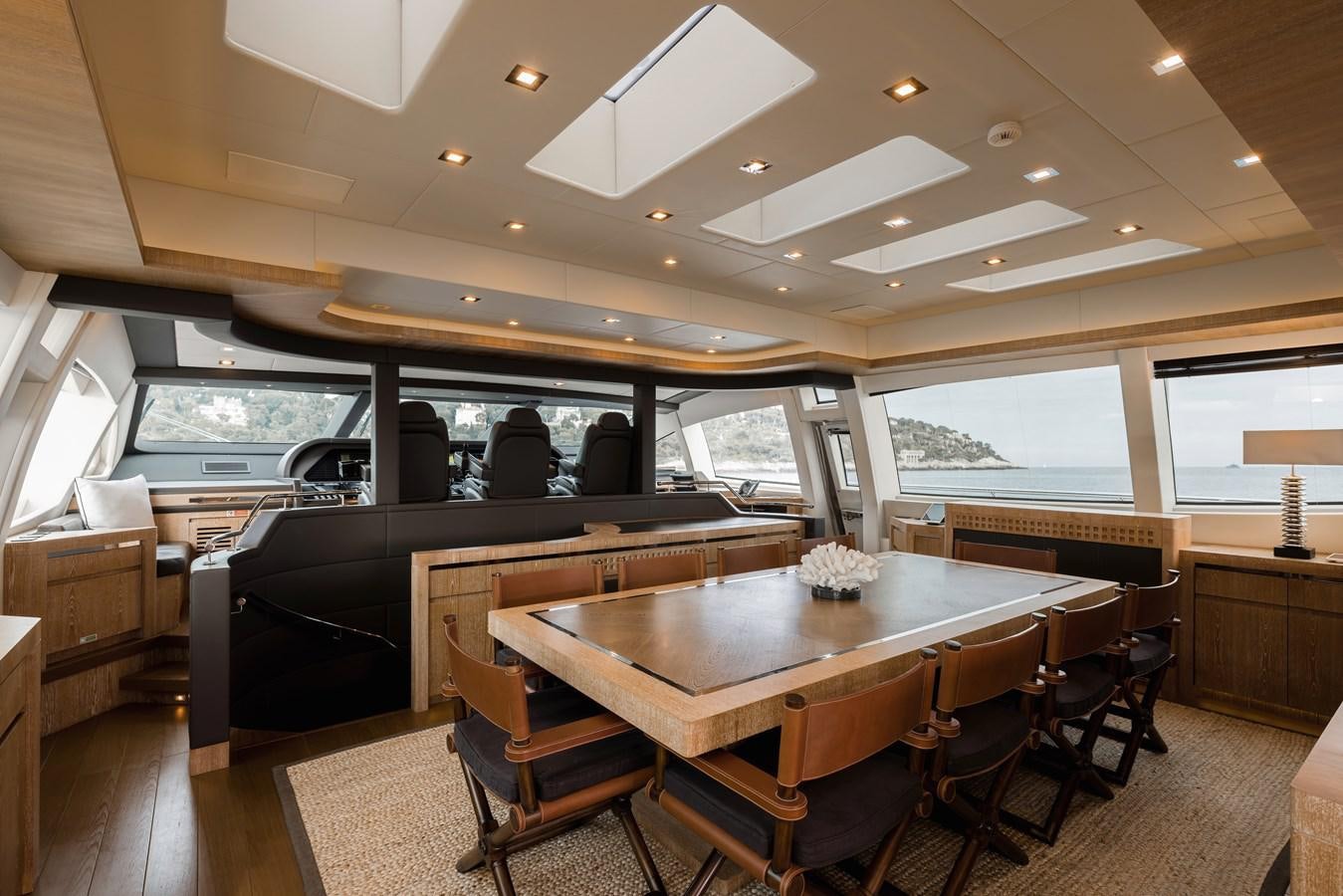 a large dining table in a room aboard ROYALE X Yacht for Sale