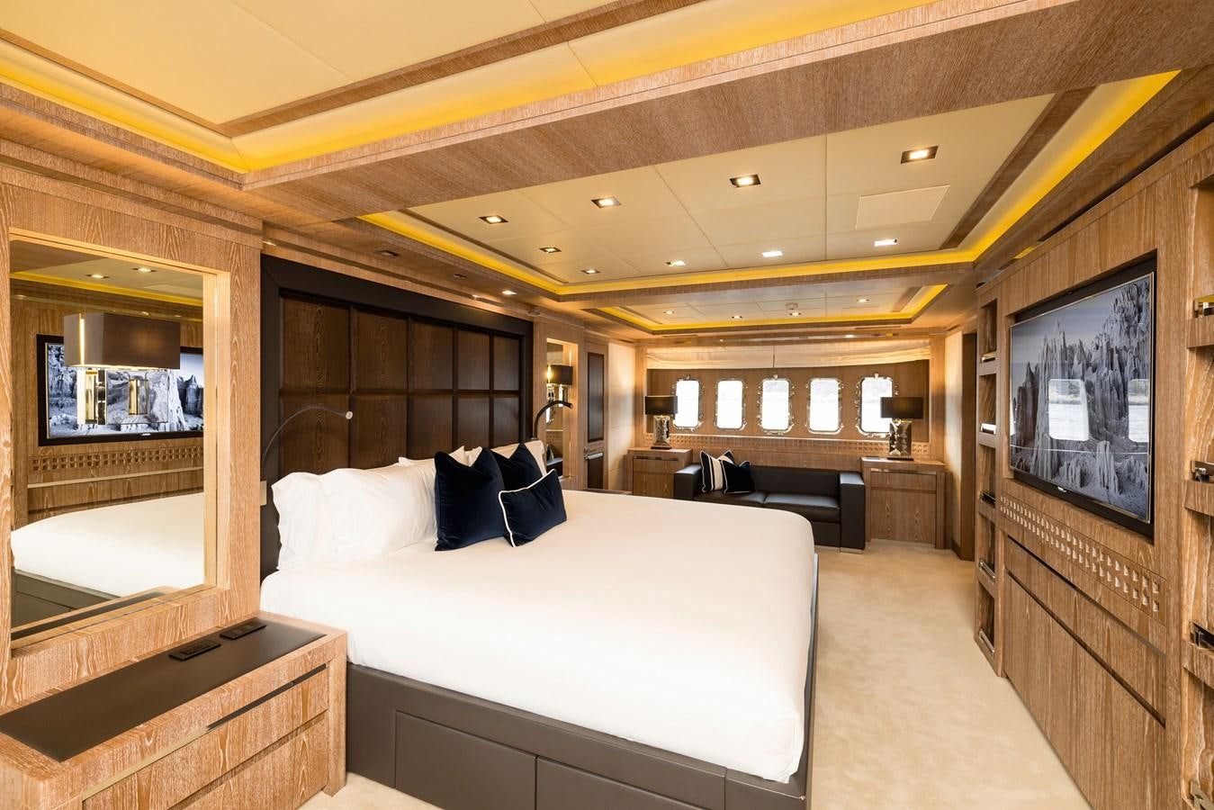 a bedroom with a large bed aboard ROYALE X Yacht for Sale