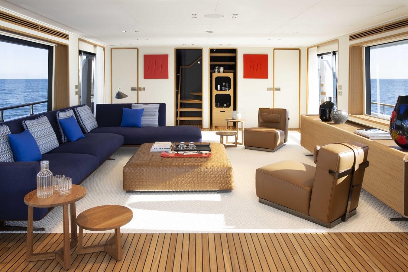 a living room with a couch and a coffee table aboard CUSTOM LINE NAVETTA 33/33 Yacht for Sale