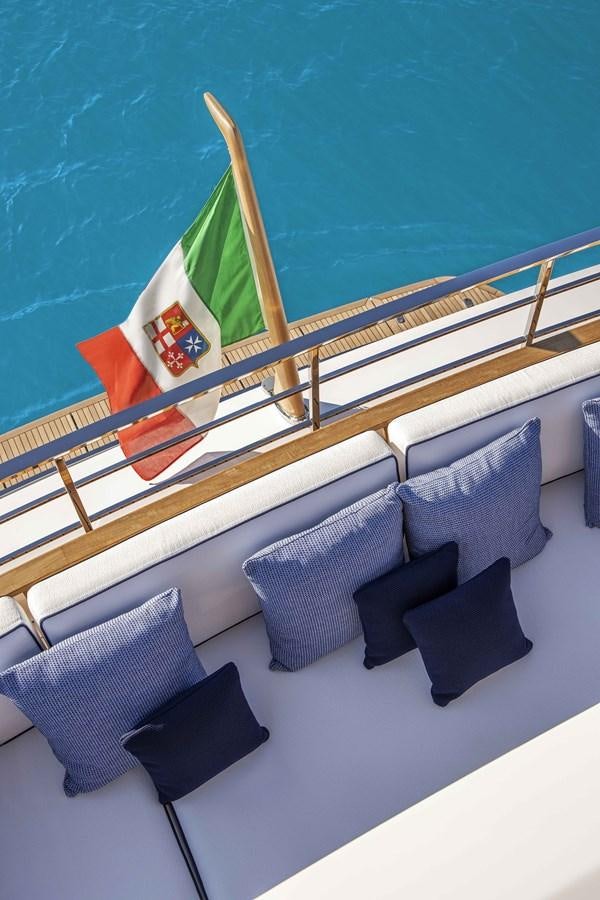 a deck with pillows and a flag aboard CUSTOM LINE NAVETTA 33/33 Yacht for Sale