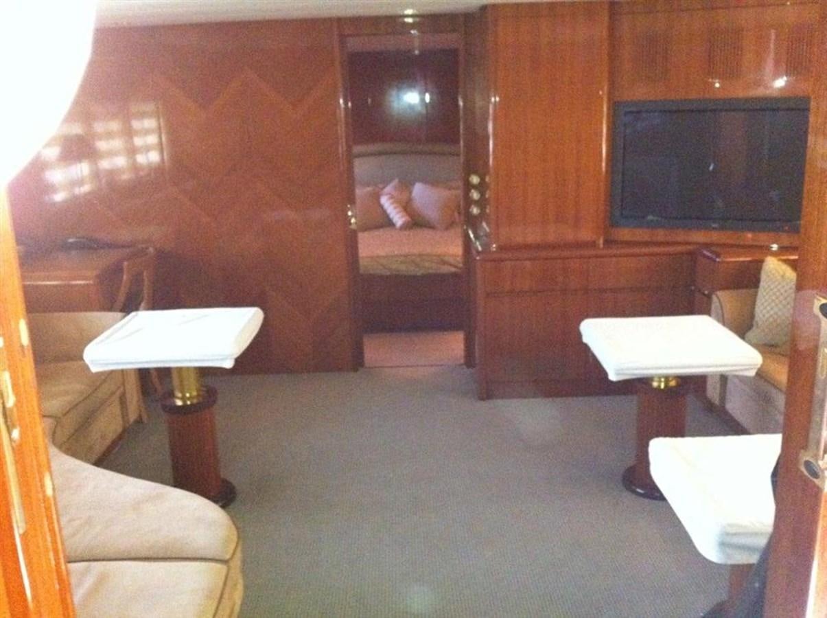 a room with a bed and desk aboard SKS Yacht for Sale