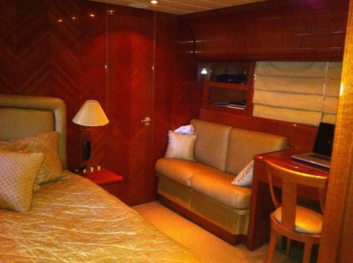 a room with a bed and a laptop on a table aboard SKS Yacht for Sale