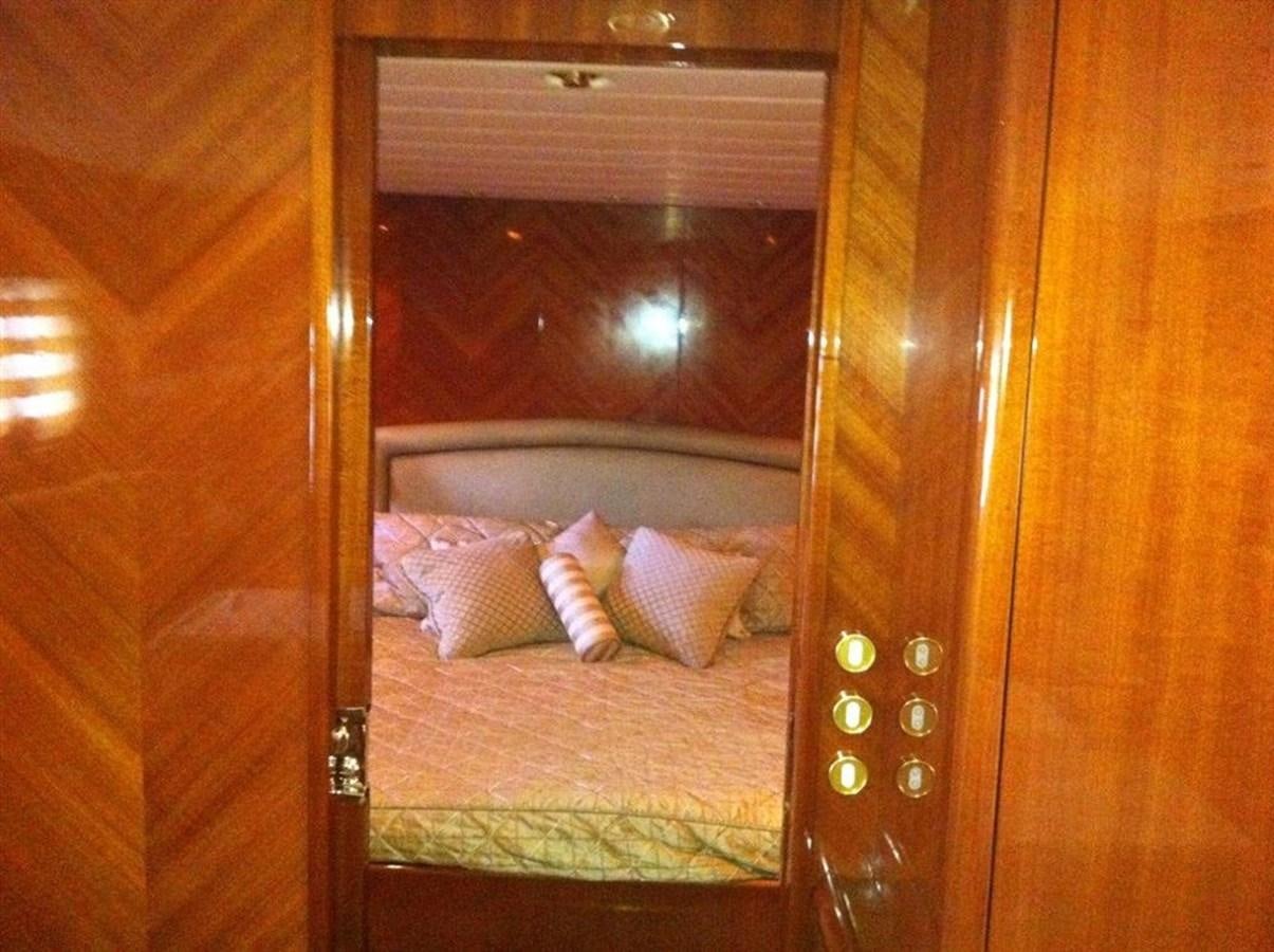 a bed with a wooden frame aboard SKS Yacht for Sale