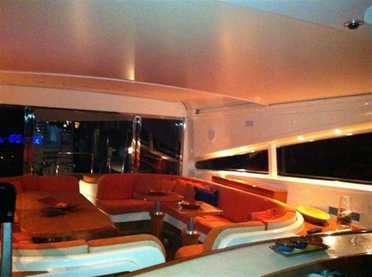 a room with a table chairs and a window aboard SKS Yacht for Sale