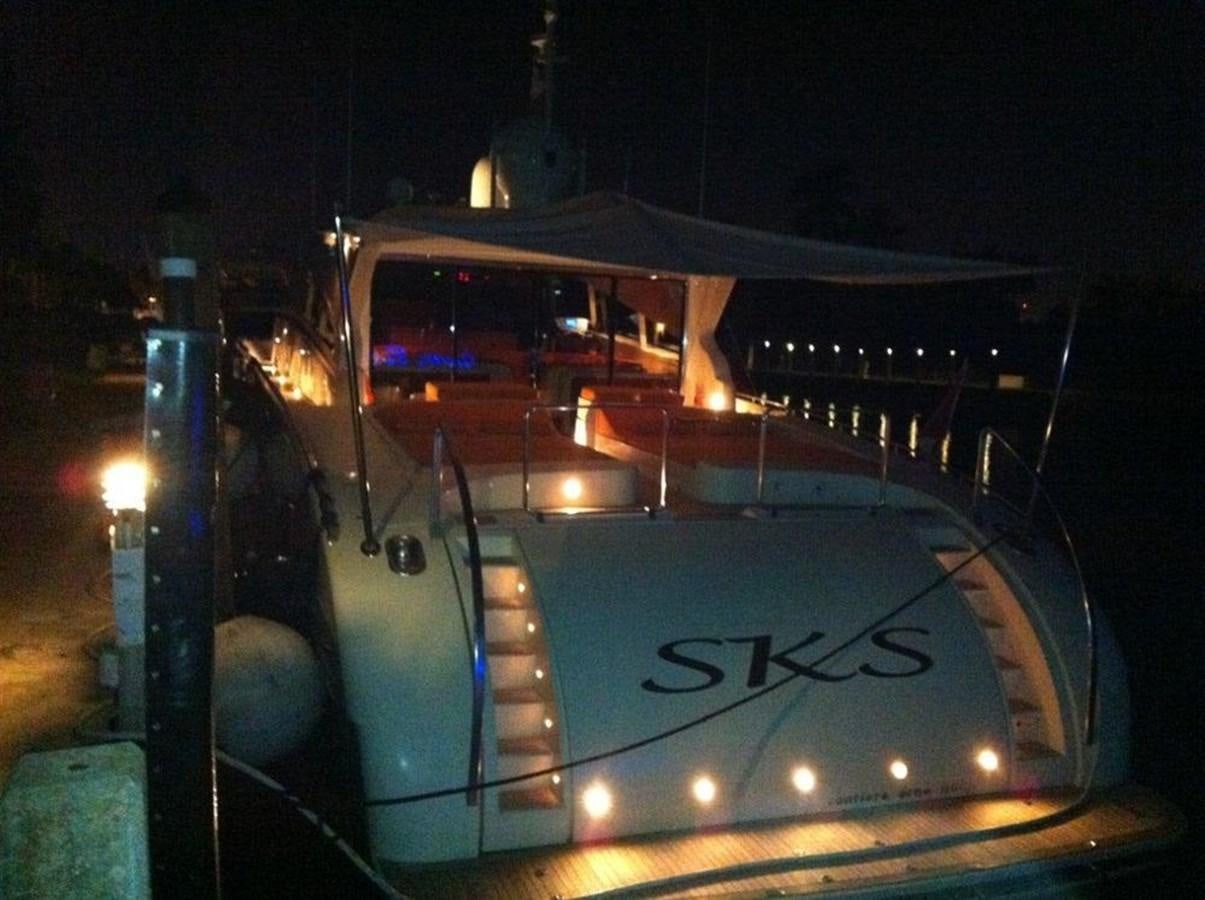 a white car with lights on aboard SKS Yacht for Sale