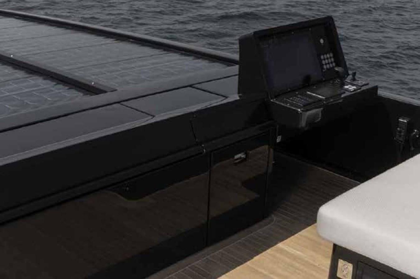 a black laptop on a deck aboard 2024 SANLORENZO SP92 #16 Yacht for Sale