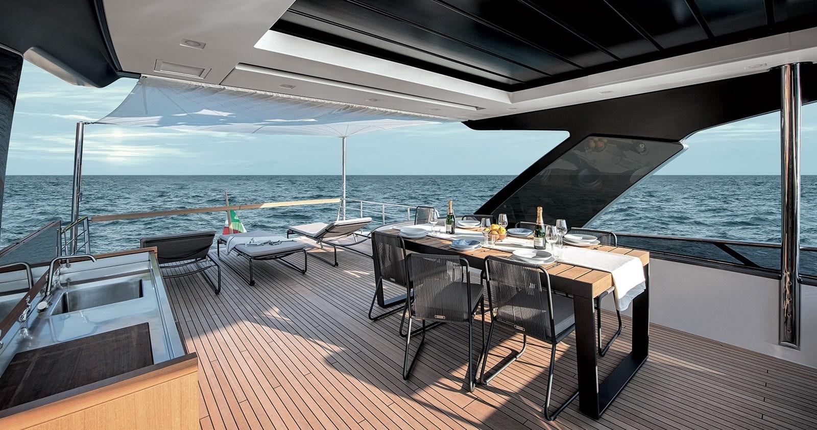 a table on a deck overlooking the ocean aboard 2021 SANLORENZO SL78 #721 Yacht for Sale
