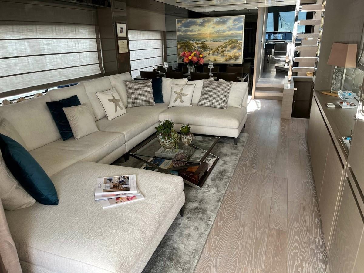 a living room with a large couch and a coffee table aboard 2021 SANLORENZO SL78 #721 Yacht for Sale