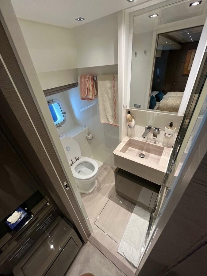 a bathroom with a sink toilet and a mirror aboard 2021 SANLORENZO SL78 #721 Yacht for Sale
