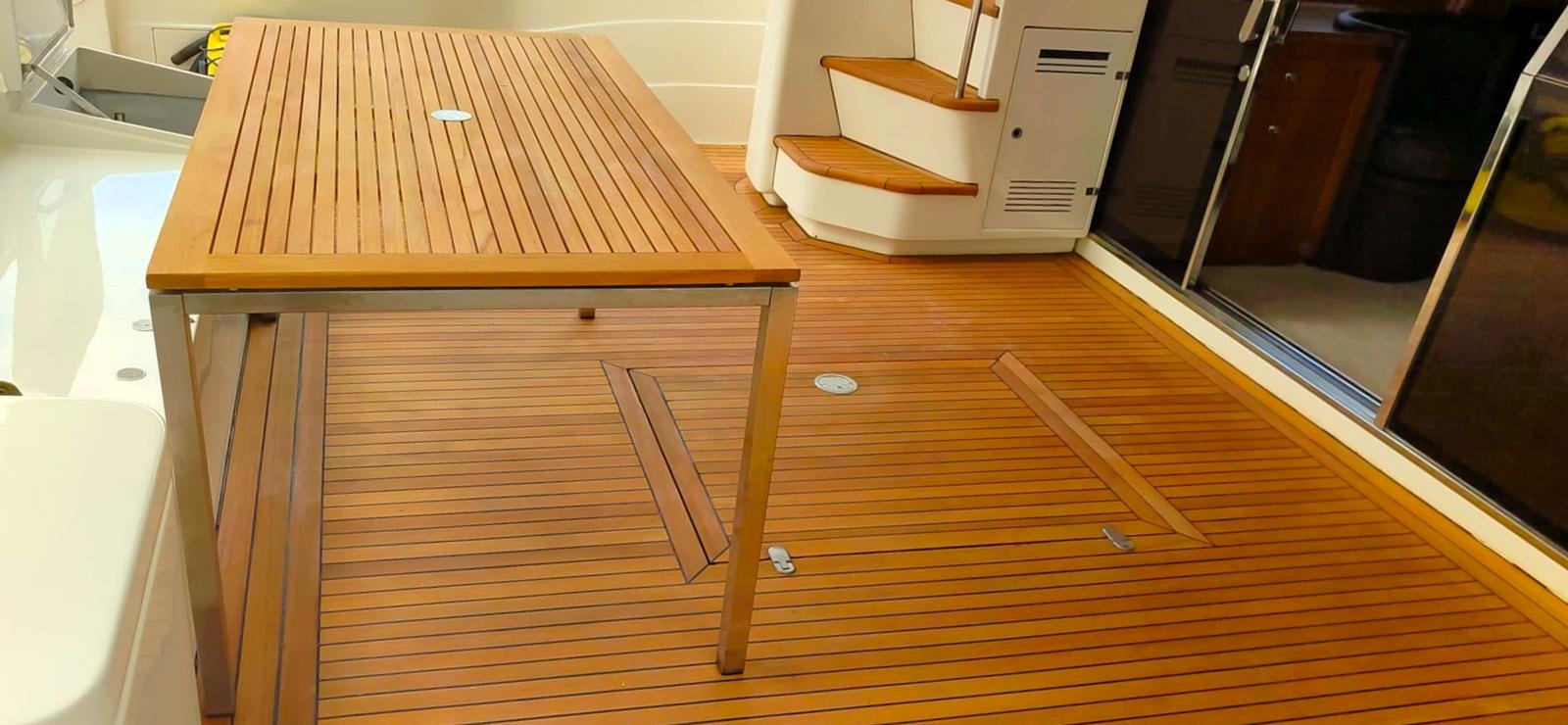 a wooden table with a few pieces of wood on it aboard GOLDEN EX Yacht for Sale