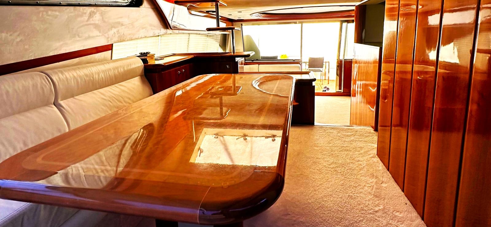 a room with a couch and a table aboard GOLDEN EX Yacht for Sale