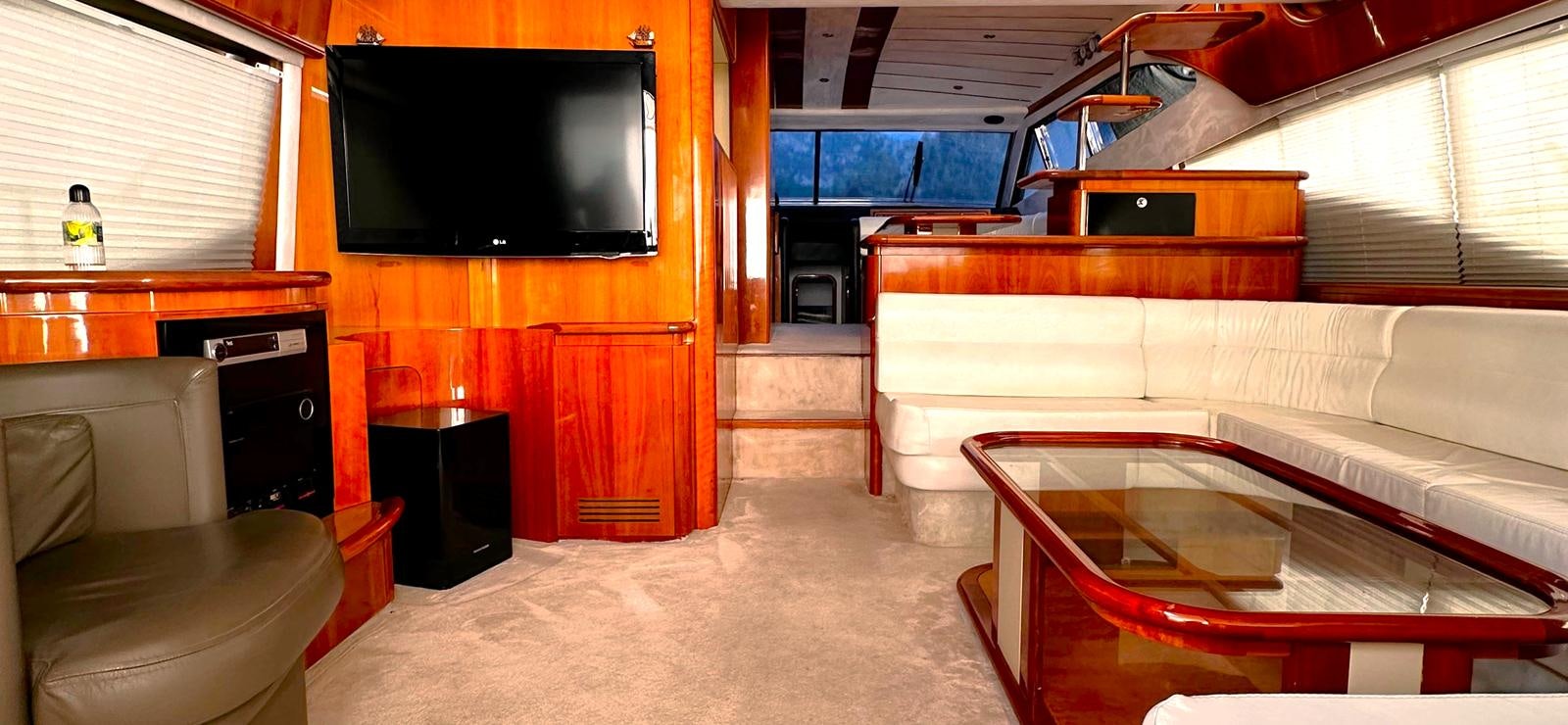 a room with a couch and a tv aboard GOLDEN EX Yacht for Sale