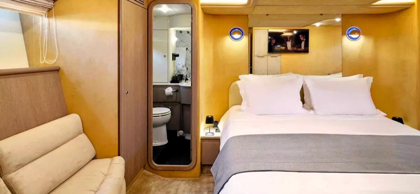 a bed in a room aboard GOLDEN EX Yacht for Sale