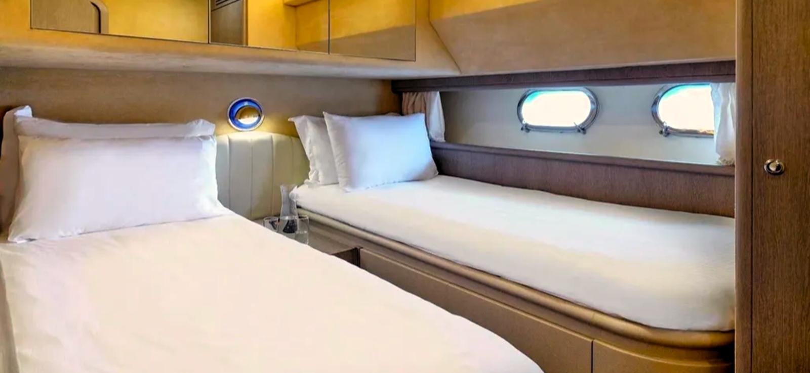 a room with two beds aboard GOLDEN EX Yacht for Sale