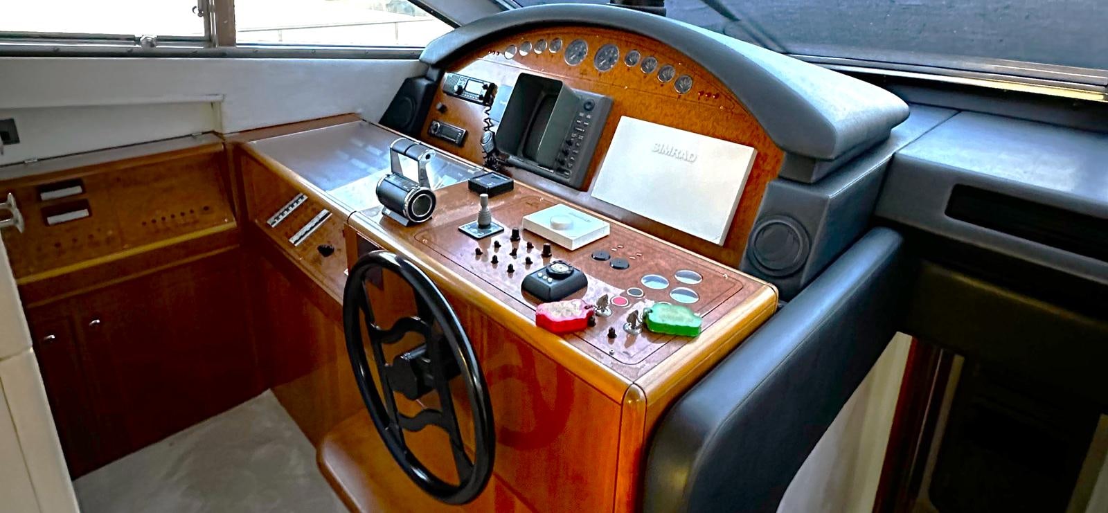 a desk with a computer and a chair aboard GOLDEN EX Yacht for Sale