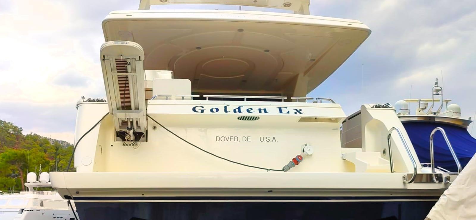 a large white boat with a large white boat on it aboard GOLDEN EX Yacht for Sale