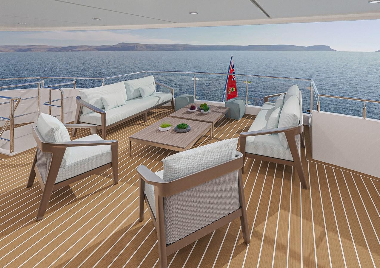 a deck with chairs and a table on it aboard DELETE Yacht for Sale