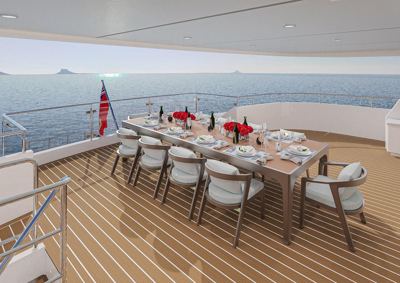 a table set for a meal on a deck overlooking the ocean aboard DELETE Yacht for Sale