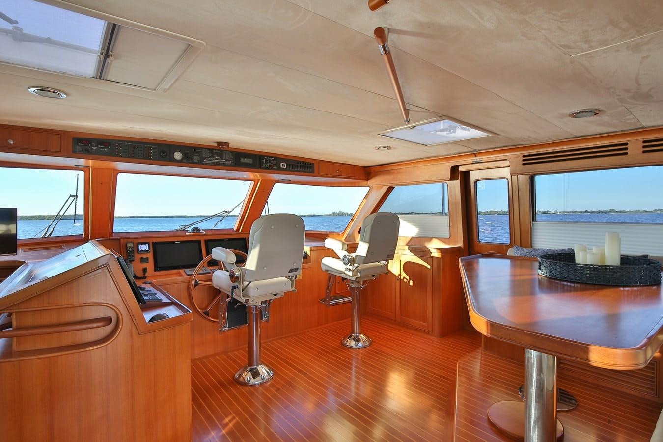 a room with a table and chairs aboard BESPOKE Yacht for Sale