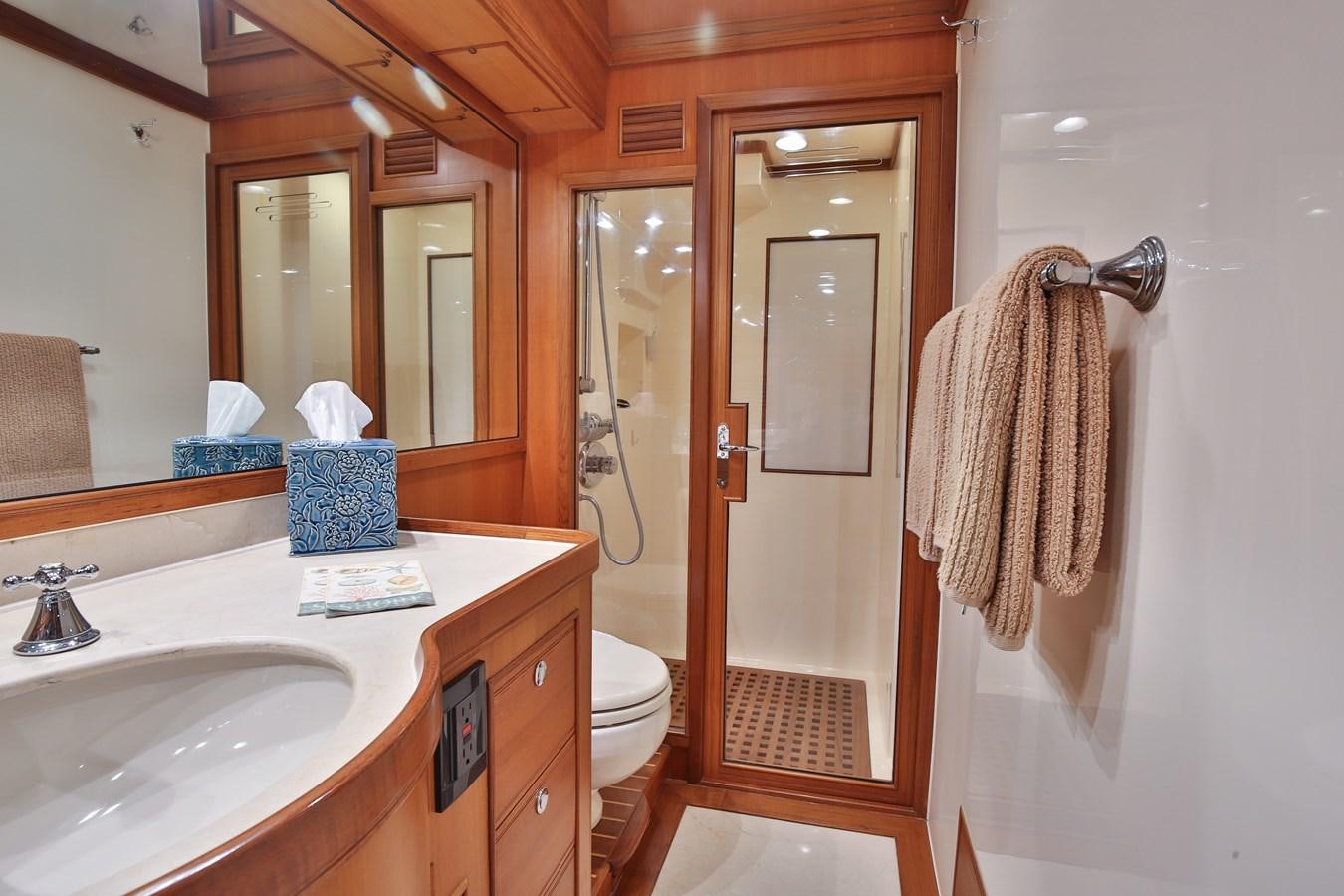 a bathroom with a sink and a toilet aboard BESPOKE Yacht for Sale