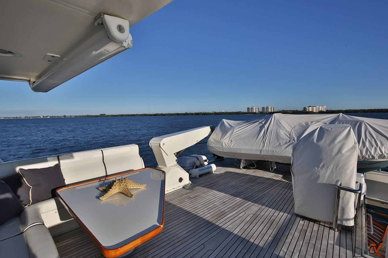 a boat on a deck aboard BESPOKE Yacht for Sale
