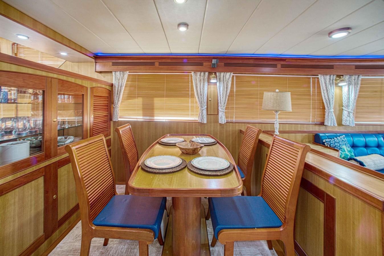a dining table in a train car aboard DISCONNECTED Yacht for Sale