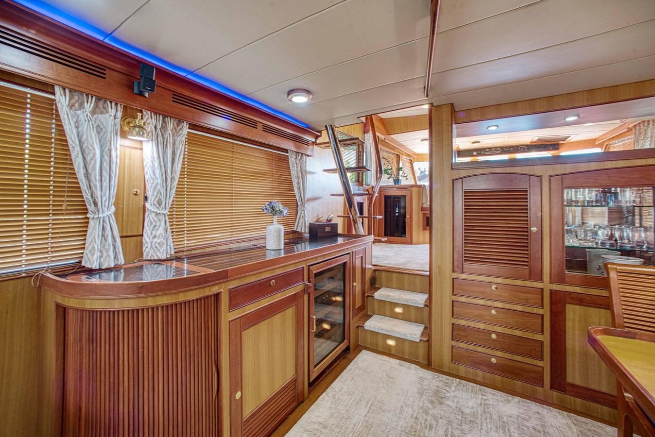 a room with wooden furniture aboard DISCONNECTED Yacht for Sale