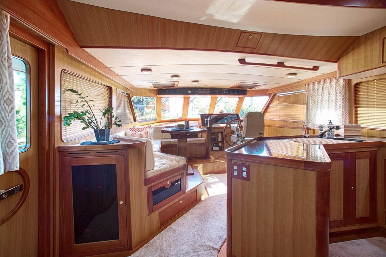 a large kitchen with a bar and bar aboard DISCONNECTED Yacht for Sale