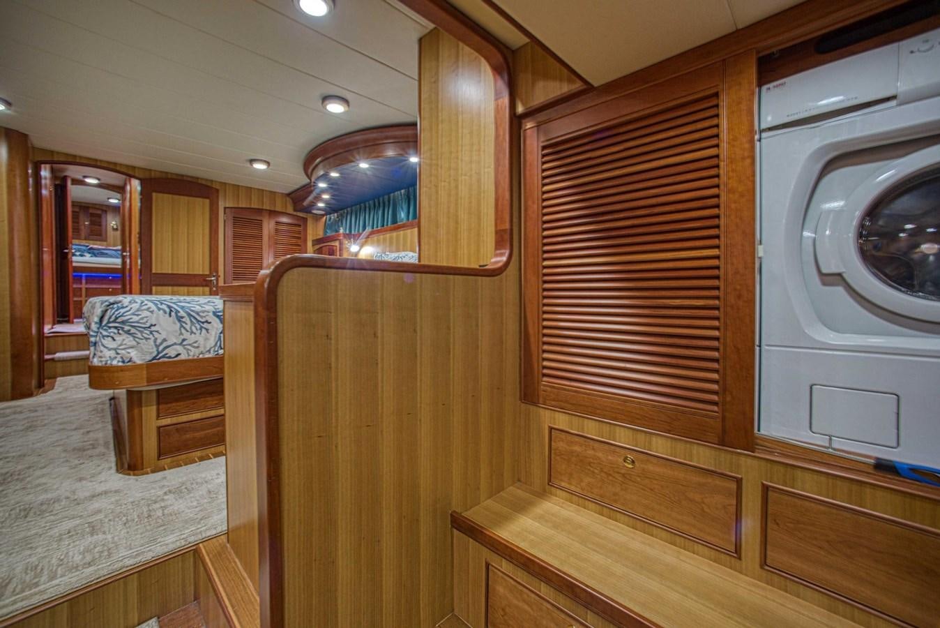 a room with wooden furniture aboard DISCONNECTED Yacht for Sale