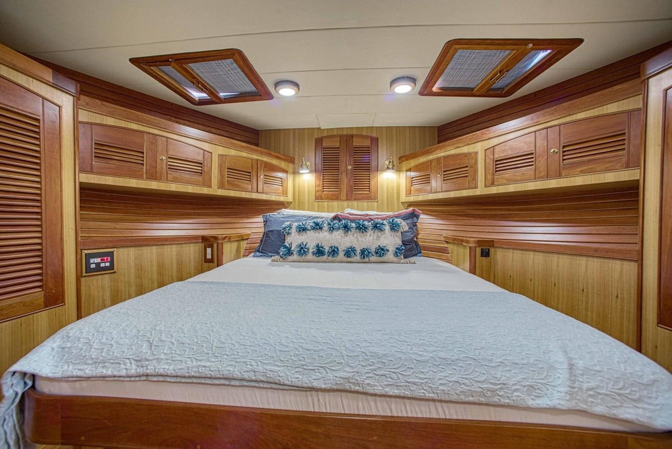 a bed in a cabin aboard DISCONNECTED Yacht for Sale