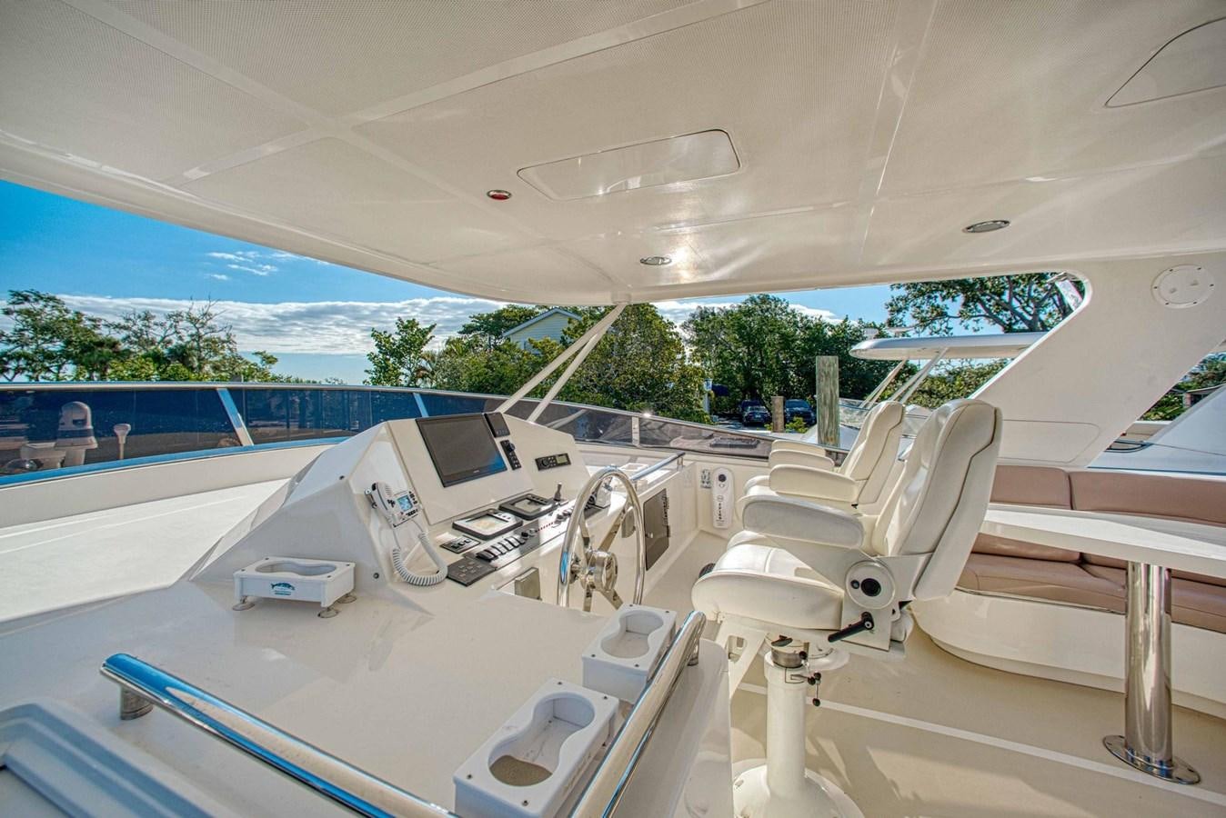 a large white room with a large window and a pool aboard DISCONNECTED Yacht for Sale