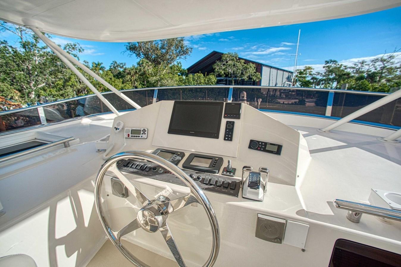 a car with a screen on the dashboard aboard DISCONNECTED Yacht for Sale
