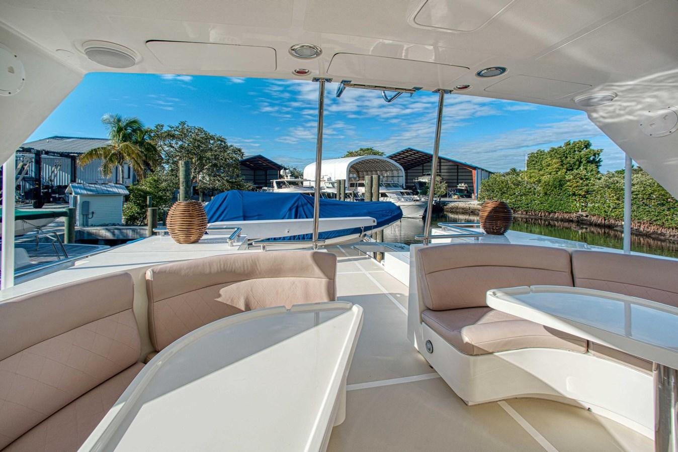 a room with a pool and lounge chairs aboard DISCONNECTED Yacht for Sale