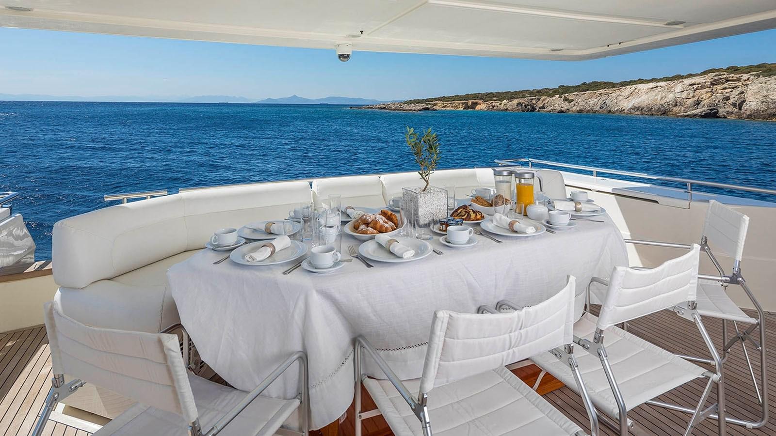 a table set for a meal on a boat aboard LAZY DAYS Yacht for Sale
