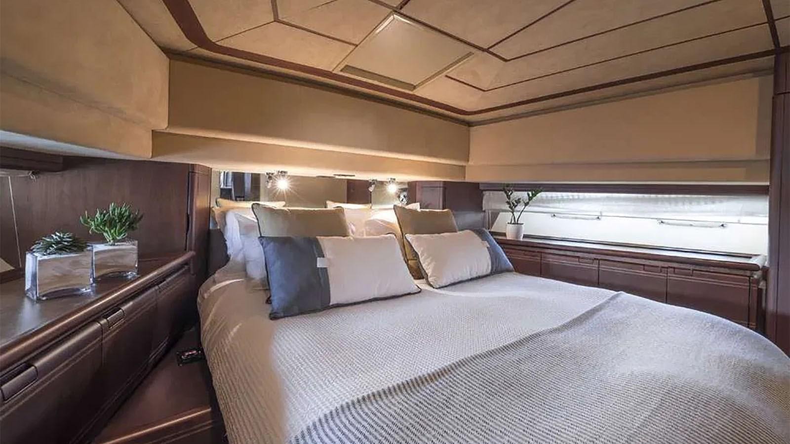 a bed with white sheets aboard LAZY DAYS Yacht for Sale