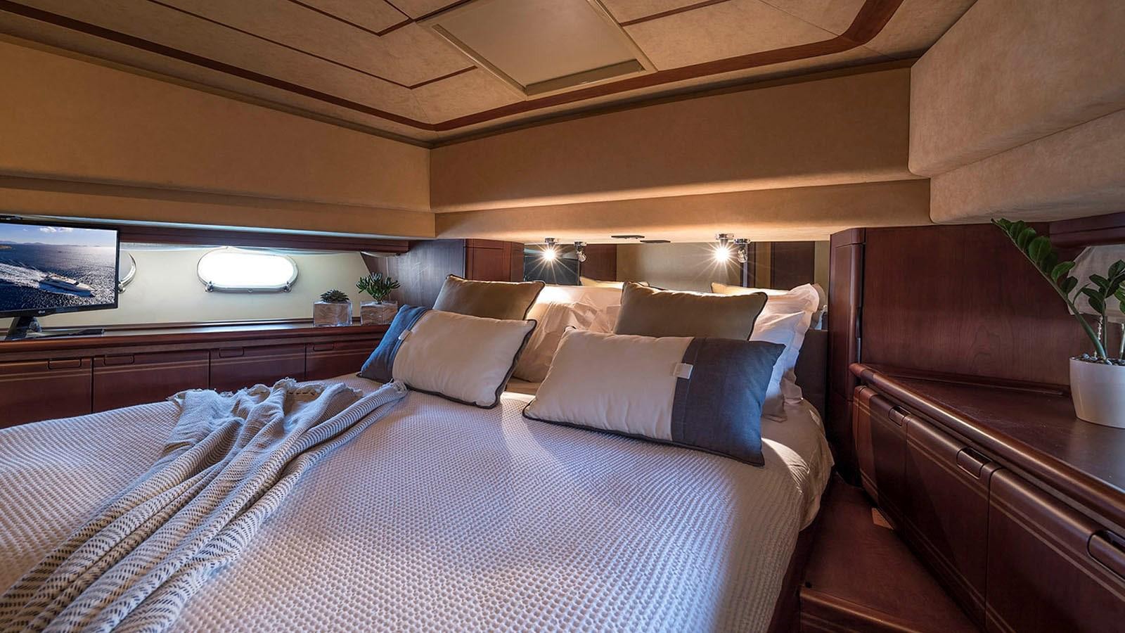 a bed with white sheets and pillows aboard LAZY DAYS Yacht for Sale