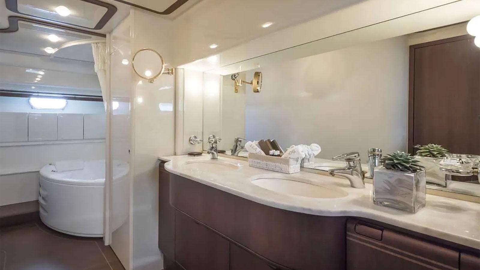 a bathroom with a large mirror aboard LAZY DAYS Yacht for Sale