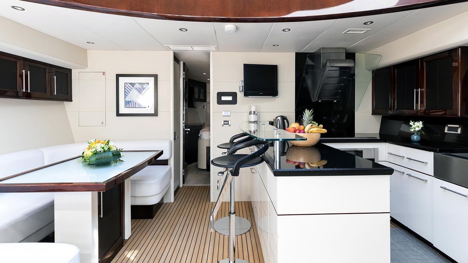 a kitchen with white cabinets aboard 2008 LAZZARA LSX 75 Yacht for Sale