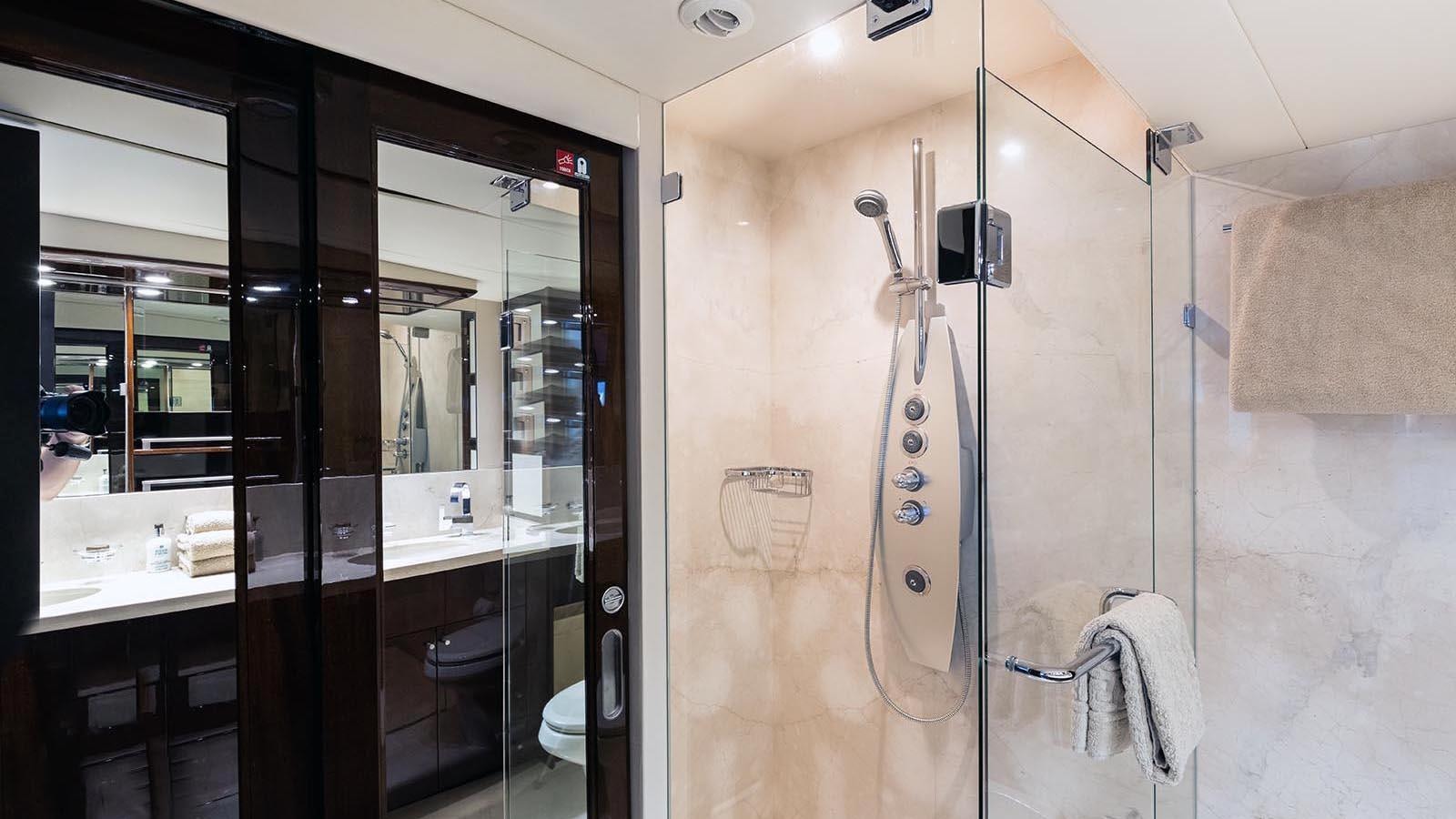 a bathroom with a shower unit aboard 2008 LAZZARA LSX 75 Yacht for Sale
