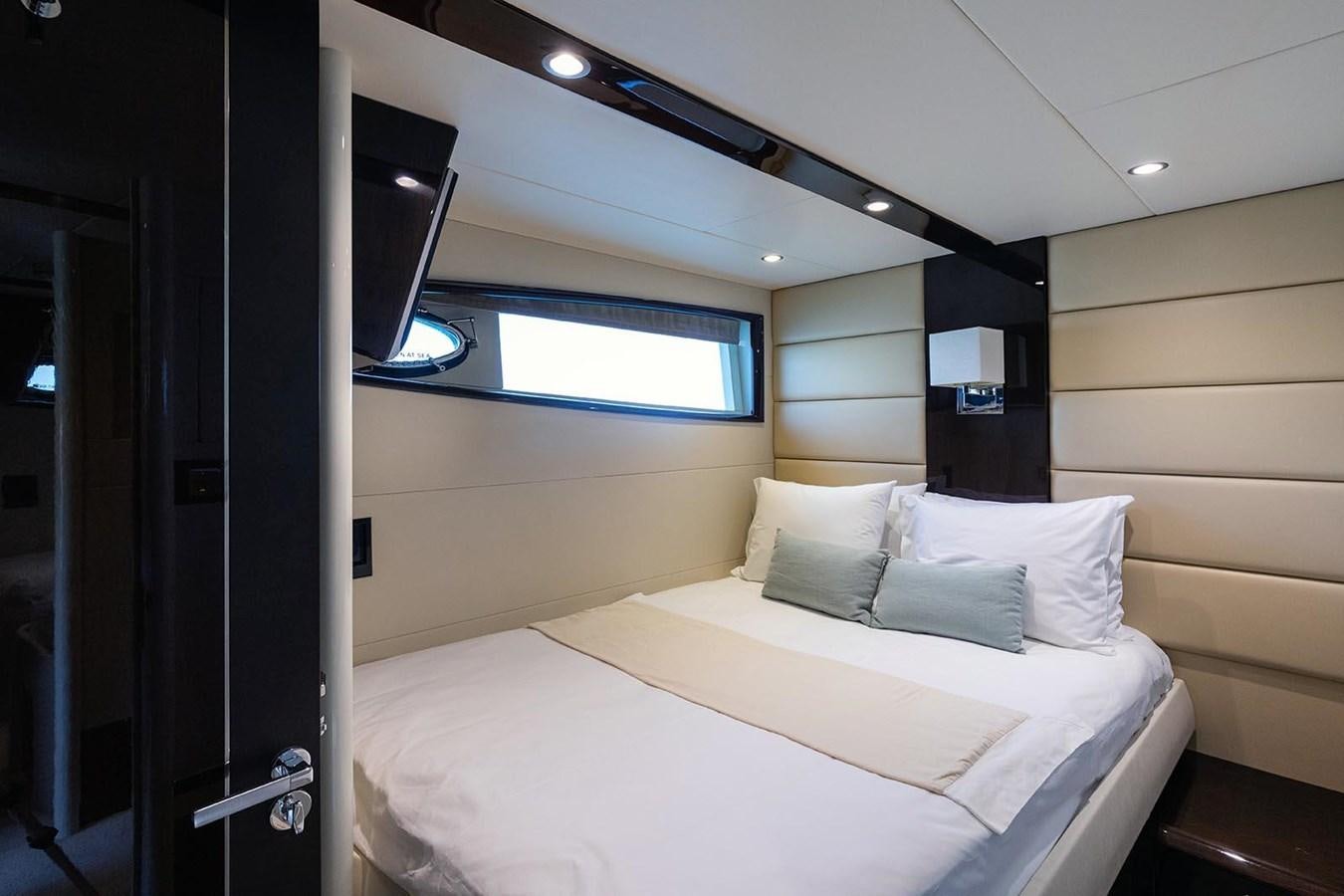 a room with a bed and a mirror aboard 2008 LAZZARA LSX 75 Yacht for Sale