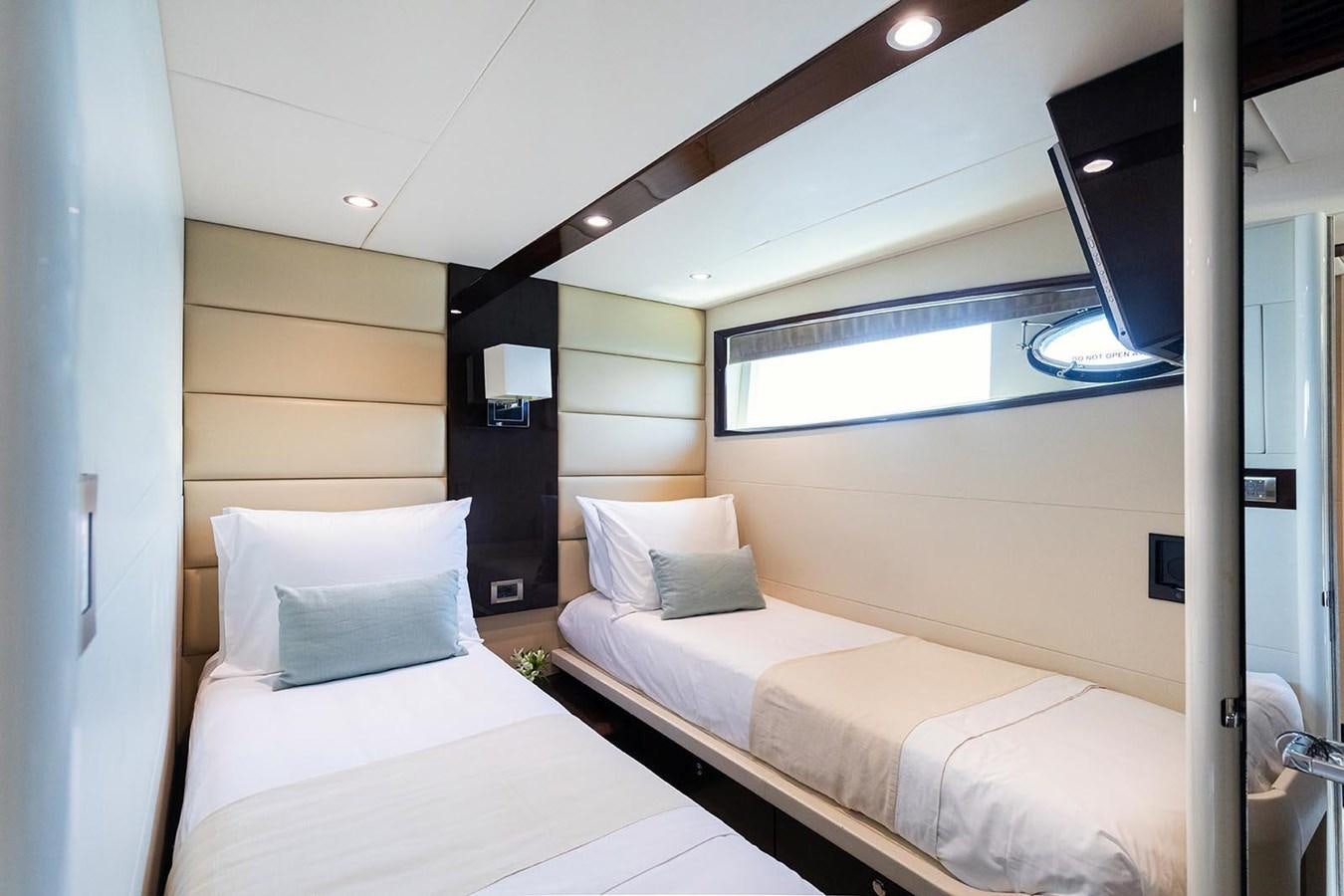 a room with two beds aboard 2008 LAZZARA LSX 75 Yacht for Sale