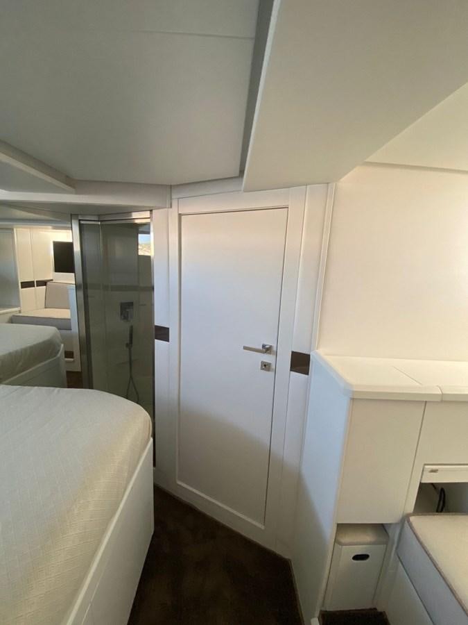 a bathroom with a large mirror aboard SUERT 70 Yacht for Sale