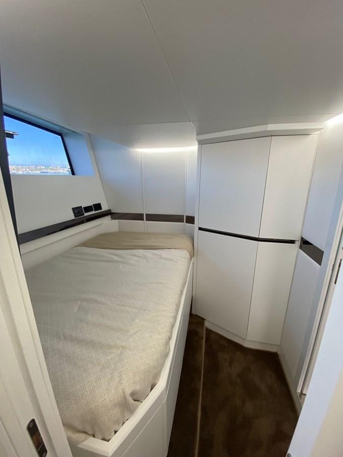 a bathroom with a tub and a window aboard SUERT 70 Yacht for Sale